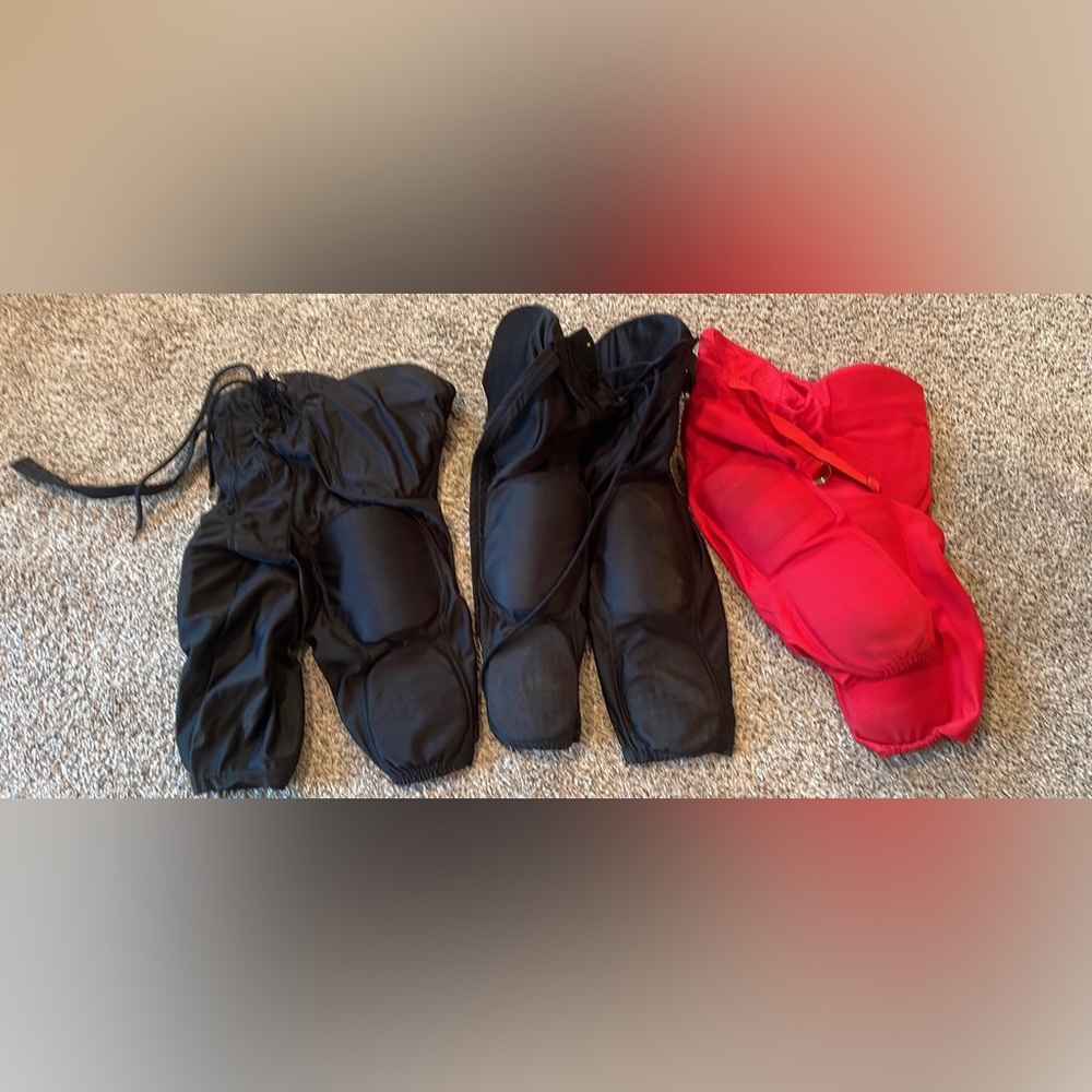 Youth large football pants red black